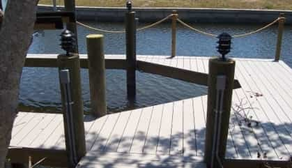 this is a picture of electrical outlets and wiring along a dock in Fort Lauderdale