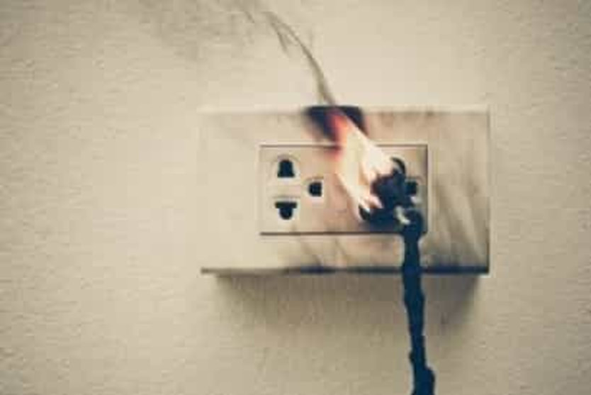 this is an image of a electrical outlet with a fire burning